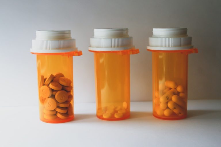 a group of glass containers with liquid