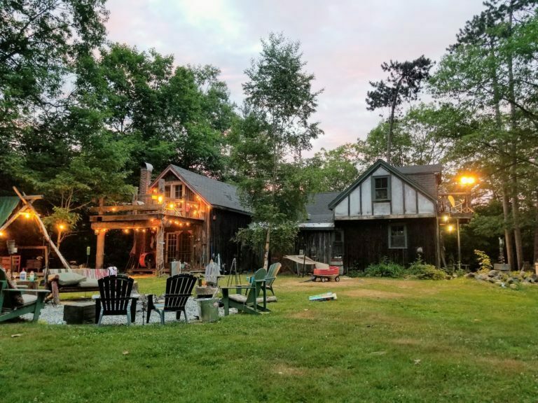a backyard with a gazebo and chairs