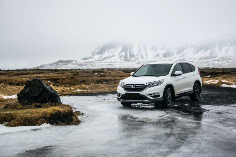 a car parked on a wet road