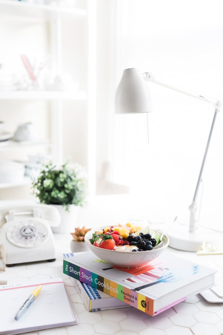 a bowl of fruit on a table
