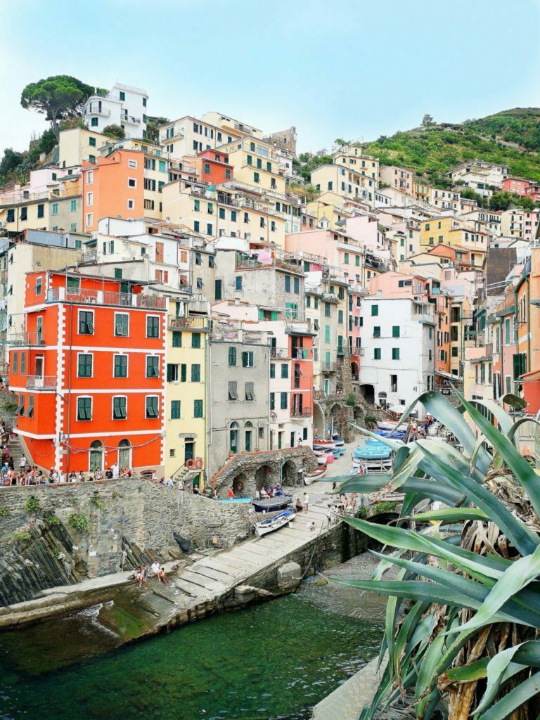 a group of buildings with a river running through it