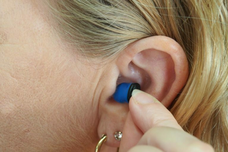 a person holding a small blue object