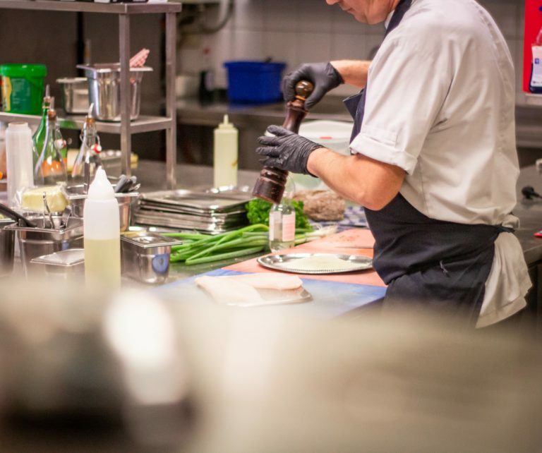 a man preparing food in a kitchen