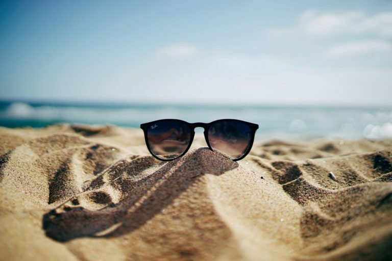 a pair of sunglasses on a rock