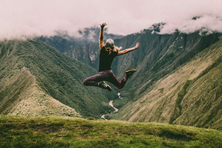 a man jumping off a cliff