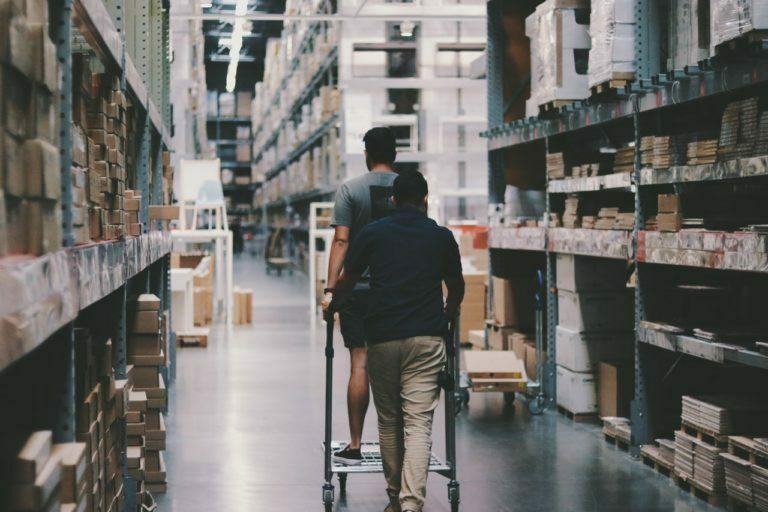 a person walking down a narrow aisle