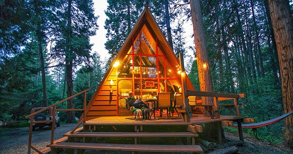 a wooden house in the woods