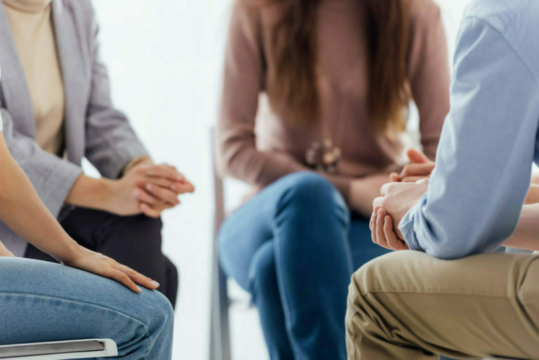 a woman and a man sitting in chairs