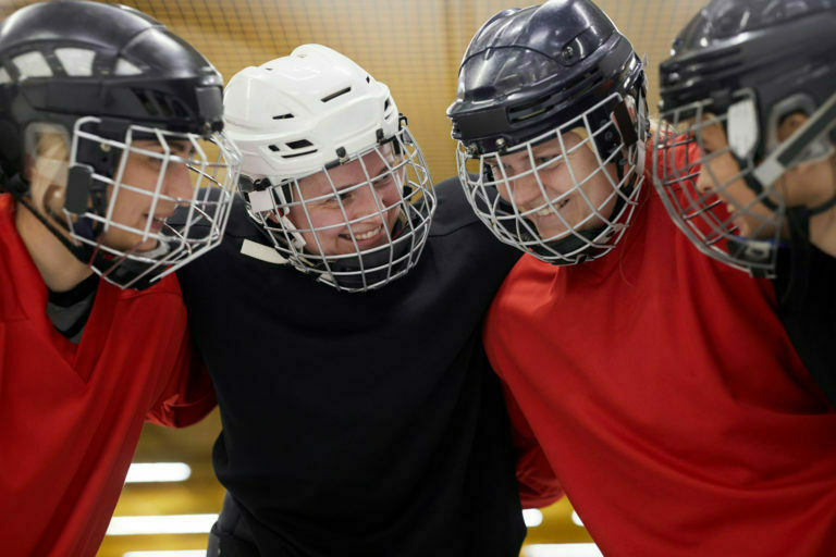 Female Hockey Team Huddling