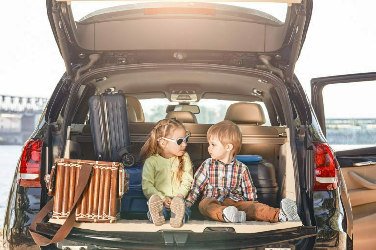kids sitting in the back of a truck