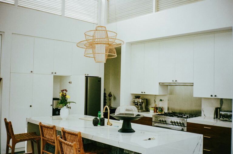 a kitchen with white cabinets